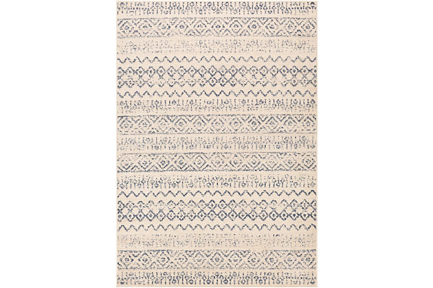 Dress up any floor with the vibrant feel and mellow hues of this tribal area rug. It welcomes visitors with warmth and comfort underfoot and graces your living space with global flair.Made of polypropylene | Machine woven | Medium pile | Imported | Spot clean only