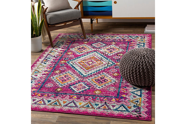 Why play it safe, when you can transform a space with big, bold and brilliant color? Saturated with deep, dramatic hues, this designer area rug stands out from the crowd for all the right reasons.Made of polypropylene and polyester | Machine woven | Medium pile | Imported | Spot clean only