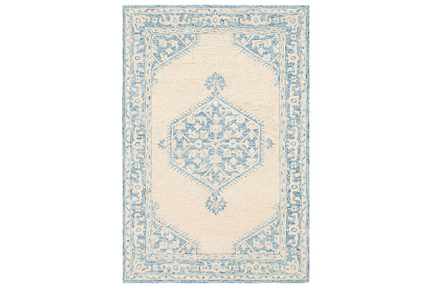 Express your worldly point of view with this exotic rug. Intricate patterns and bold, brilliant hues capture the look of far away places and add an element of allure to your design.Made of wool | Hand-tufted | Wool fibers are prone to shedding, vacuum regularly and shedding will subside                             Low pile; canvas (with latex) backing | Spot clean recommended | Imported