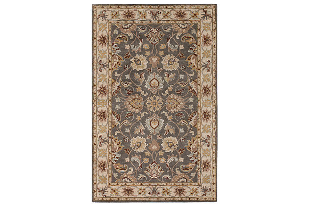 Classic design elements create a rug that's timeless in elegance and universal in appeal. Posh palette and distinctive pattern clearly reflect your good taste.Made of wool | Hand-tufted; medium pile | Spot clean recommended | Imported | Canvas backing