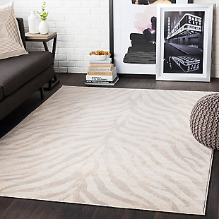 Go wild—within reason—with this subtle animal print rug. Thanks to its neutral color palette, this area rug plays nicely with other hues and can easily be placed on top of carpet or a natural-tone sisal rug for a layered look.Made of polypropylene | Machine woven; medium pile | Spot clean recommended | Imported | Rug pad recommended | Imported