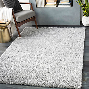 Indulge in retro revival with this sumptuous shag rug with subtle geometric design. Plush pile is loaded with fun, feel-good texture. Harmonious hues make it a tasteful choice for so many spaces.Made of polypropylene | Machine woven | Plush pile | Rug pad recommended | Spot clean recommended | Imported
