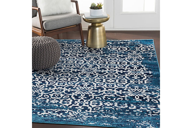 Why play it safe, when you can transform a space with big, bold and brilliant color? Saturated with deep, dramatic hues, this designer area rug stands out from the crowd for all the right reasons.Made of polypropylene | Machine woven | Medium pile | Rug pad recommended | Spot clean recommended | Imported