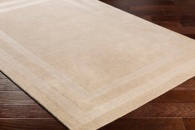 Dress up any floor with the natural hue and designer look of this rug. It welcomes visitors with warmth and comfort underfoot. Neutral color palette exudes a marvelously modern vibe which works wonders in any setting.Made of wool and nylon | Hand-tufted | Low pile | Rug pad recommended | Spot clean | Imported