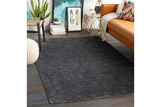 Dress up any floor with the bold hue and designer look of this rug. It welcomes visitors with warmth and comfort underfoot. Complementary color palette exudes a marvelously modern vibe which works wonders in any setting.Made of wool, cotton and viscose | Hand-knotted |  pile | Rug pad recommended | Spot clean | Imported