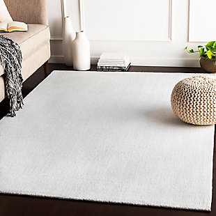 Dress up any floor with the natural hue and designer look of this rug. It welcomes visitors with warmth and comfort underfoot. Neutral color palette exudes a marvelously modern vibe which works wonders in any setting.Made of polyester | Hand-loomed | Low pile | Rug pad recommended | Spot clean | Imported