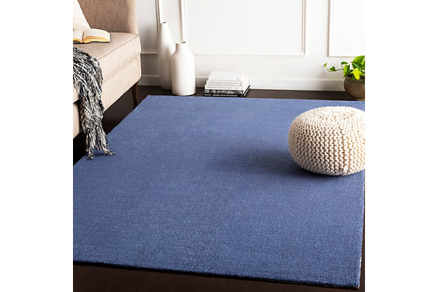 Dress up any floor with the natural hue and designer look of this rug. It welcomes visitors with warmth and comfort underfoot. Bold color palette exudes a marvelously modern vibe which works wonders in any setting.Made of polyester | Hand-loomed | Low pile | Rug pad recommended | Spot clean | Imported