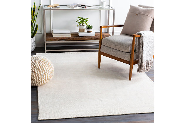 Dress up any floor with the natural hue and designer look of this rug. It welcomes visitors with warmth and comfort underfoot. Neutral color palette exudes a soothing sensibility which works wonders in any setting.Made of viscose and wool | Hand-knotted | Low pile | Rug pad recommended | Imported | Spot clean only