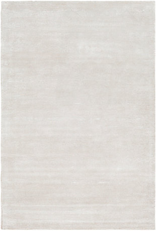 Dress up any floor with the natural hue and designer look of this rug. It welcomes visitors with warmth and comfort underfoot. Neutral color palette exudes a soothing sensibility which works wonders in any setting.Made of wool and viscose | Hand-tufted | Low pile | Rug pad recommended | Imported | Spot clean only