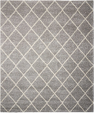 Texture and substance meet style and color with this area rug. This sensational shag is elevated with a trend-setting ash gray and ivory diamond pattern. Lavish pile makes this rug a haven for your feet. Who knew beautiful home fashion could feel so good?100% polypropylene | Machine woven | Jute backing; rug pad recommended | Imported | Spot clean