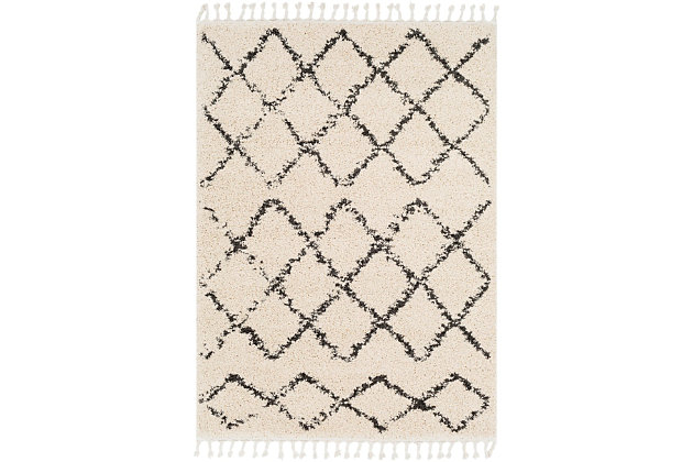 Dress up any floor with the mellow hues and energetic feel of this designer tribal rug. It welcomes visitors with warmth and comfort underfoot. Dynamic design is sure to add interest to your living space.Made of polypropylene | Machine woven | Plush pile | No backing; rug pad recommended | Imported | Spot clean