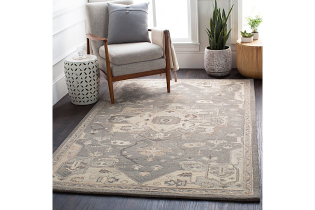 An updated interpretation of the classic medallion design, this rug delights with its fresh feel and timeless appeal. Pleasing palette grounds your space in perfect harmony.Made of wool | Hand-tufted | Medium pile | Canvas backing; rug pad recommended | Wool fibers are prone to shedding, vacuum regularly and shedding will subside | Imported | Spot clean only