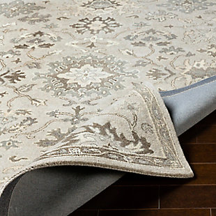 Dress up any floor with the natural hue and designer look of this rug. It welcomes visitors with warmth and comfort underfoot. Neutral color palette exudes a marvelously modern vibe which works wonders in any setting.Made of wool | Hand-tufted | Medium pile | Canvas backing; rug pad recommended | Wool fibers are prone to shedding, vacuum regularly and shedding will subside | Imported | Spot clean only
