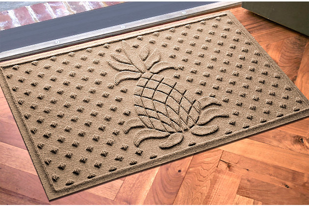 From the front door to the back door and all points in between, the Aqua Shield diamond pineapple doormat is sure to keep your floors clean and dry. Beyond scraping dirt from shoes and paws, it’s got an exclusive “water dam” design for unbeatable absorbency. Resistant to the most extreme weather elements, this doormat is certified slip resistant by the National Floor Safety Institute. Talk about one heck of a welcome mat.Made of polypropylene with rubber backing | Machine made | Crush proof | Raised border keeps dirt and water in the mat, not on your floor | Absorbs one gallon of water per square yard | Mold/mildew/fade resistant | Anti-static and weather resistant | Suitable for indoor/outdoor use | Hose clean, then hang to dry or dry flat | Made in u.s.a.