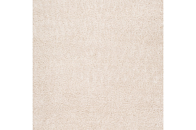 Dress up any floor with the natural hue and designer look of this rug. It welcomes visitors with warmth and comfort underfoot. Neutral color palette exudes a marvelously modern vibe which works wonders in any setting.Made of polypropylene | Machine woven | Shag pile | Rug pad recommended | Spot clean | Imported