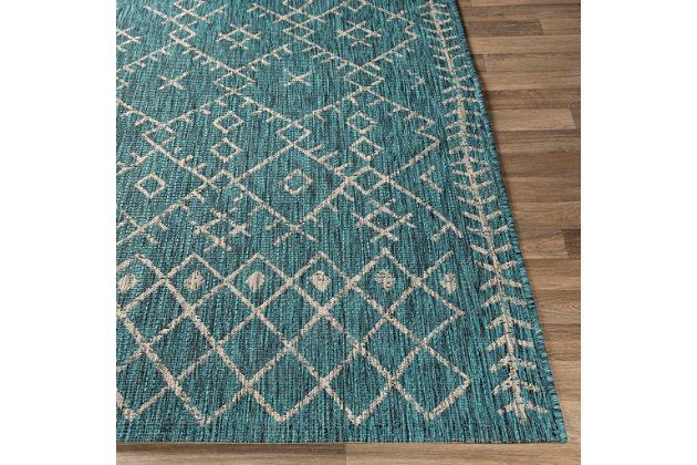Simply timeless and beautifully on trend, this masterfully crafted Moroccan style area rug is dressed to impress. Easy elegant and casually cool, it looks right at home whether your furnishings are retro, boho or somewhere in between.Made of polypropylene | For indoor/outdoor use | UV resistant; water resistant | Machine woven | No pile | No backing; rug pad recommended | Spot clean | Imported
