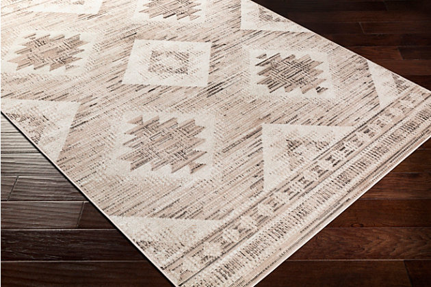Dress up any floor with the soft hues and energetic feel of this tribal rug. It welcomes visitors with warmth and comfort underfoot. Dynamic design is sure to add interest to your living space.Made of polypropylene | Machine woven | Low pile | Rug pad recommended | Spot clean | Imported