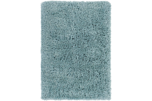 Dress up any floor with the natural hue and designer look of this rug. It welcomes visitors with warmth and comfort underfoot. A soothing color palette exudes a marvelously modern vibe which works wonders in any setting.Made of polyester | Handwoven | Shag pile | Rug pad recommended | Spot clean | Imported