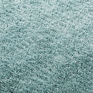 Dress up any floor with the soft hue and designer look of this rug. It welcomes visitors with warmth and comfort underfoot. A soothing color palette exudes a marvelously modern vibe which works wonders in any setting.Made of polyester | Handwoven | Shag pile | Rug pad recommended | Spot clean | Imported