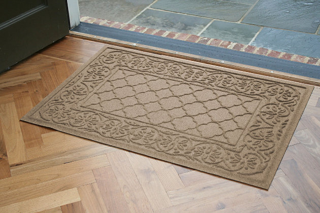 From the front door to the back door and all points in between, the Aqua Shield Rosalie doormat with a floral and lattice pattern is sure to keep your floors clean and dry. Beyond scraping dirt from shoes and paws, it’s got an exclusive “water dam” design for unbeatable absorbency. Resistant to the most extreme weather elements, this doormat is certified slip resistant by the National Floor Safety Institute. Talk about one heck of a welcome mat.Made of polypropylene with rubber backing | Machine made | Crush proof | Raised border keeps dirt and water in the mat, not on your floor | Absorbs one gallon of water per square yard | Mold/mildew/fade resistant | Anti-static and weather resistant | Suitable for indoor/outdoor use | Hose clean, then hang to dry or dry flat | Made in u.s.a.