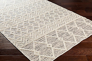 Made in the fade. Sporting a weathered effect for a relaxed sensibility, this area rug conveys what peaceful living is all about. Easy-care construction and exceptional versatility make it a practical choice for any space you please.100% wool | Handwoven | No pile | Rug pad recommended | Spot clean | Imported