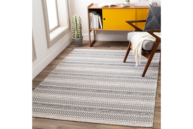 Soft stripes and a classic color pairing make a simply stri statement. This unassuming floor covering adds a dimensional quality that aligns your space in a decidedly modern way.Made of cotton | Machine woven | No pile | Machine Washable (Cold Water Only – Hang Dry) or Spot Clean | Imported