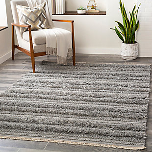 Mellow stripes and a classic color pairing make a simply striking statement. This comfortably plush area rug aligns your space in a decidedly modern way.Made of viscose and wool | Handwoven | Plush pile | Rug pad recommended | Spot clean | Imported