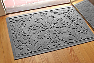 From the front door to the back door and all points in between, the Aqua Shield damask doormat is sure to keep your floors clean and dry. Beyond scraping dirt from shoes and paws, it’s got an exclusive “water dam” design for unbeatable absorbency. Resistant to the most extreme weather elements, this doormat is certified slip resistant by the National Floor Safety Institute. Talk about one heck of a welcome mat.Made of polypropylene with rubber backing | Machine made | Crush proof | Raised border keeps dirt and water in the mat, not on your floor | Absorbs one gallon of water per square yard | Mold/mildew/fade resistant | Anti-static and weather resistant | Suitable for indoor/outdoor use | Hose clean, then hang to dry or dry flat | Made in u.s.a.