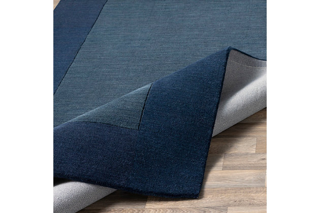 Talk about blending in yet standing out. While decidedly simple, this multitonal rug is wonderfully complex upon closer inspection. If you’re looking for colorful inspiration, you’ll love its host of  bold hues. Exuding an easy-elegant sensibility, this versatile area rug works equally well in formal places and casually cool spaces.100% wool | Hand-loomed | High pile | Rug pad recommended | Spot clean | Imported | Canvas backing