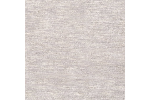 Talk about blending in yet standing out. While decidedly simple, this multitonal rug is wonderfully complex upon closer inspection. If you’re looking for cool inspiration, you’ll love its host of soft hues. Exuding an easy-elegant sensibility, this versatile area rug works equally well in formal places and casually cool spaces.100% wool | Hand-loomed | High pile | Rug pad recommended | Spot clean | Imported | Canvas backing