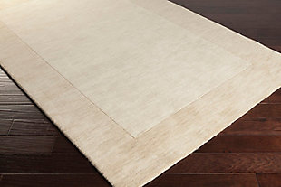 Talk about blending in yet standing out. While decidedly simple, this multitonal rug is wonderfully complex upon closer inspection. If you’re looking for neutral inspiration, you’ll love its host of mellow hues. Exuding an easy-elegant sensibility, this versatile area rug works equally well in formal places and casually cool spaces.100% wool | Hand-loomed | High pile | Rug pad recommended | Spot clean | Imported