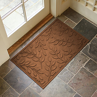 From the front door to the back door and any points in between, the Aqua Shield brittany leaf doormat is sure to keep your floors clean and dry. Beyond scraping dirt from shoes and paws, it’s got an exclusive “water dam” design for unbeatable absorbency. Resistant to the most extreme weather elements, this doormat is certified slip resistant by the National Floor Safety Institute. Talk about one heck of a welcome mat.Made of polypropylene with rubber backing | Machine made | Crush proof | Raised border keeps dirt and water in the mat, not on your floor | Absorbs one gallon of water per square yard | Mold/mildew/fade resistant | Anti-static and weather resistant | Suitable for indoor/outdoor use | Hose clean, then hang to dry or dry flat | Made in u.s.a.