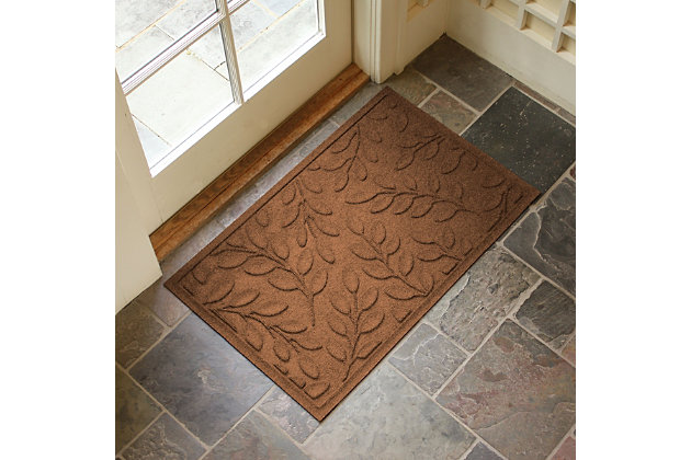 From the front door to the back door and any points in between, the Aqua Shield brittany leaf doormat is sure to keep your floors clean and dry. Beyond scraping dirt from shoes and paws, it’s got an exclusive “water dam” design for unbeatable absorbency. Resistant to the most extreme weather elements, this doormat is certified slip resistant by the National Floor Safety Institute. Talk about one heck of a welcome mat.Made of polypropylene with rubber backing | Machine made | Crush proof | Raised border keeps dirt and water in the mat, not on your floor | Absorbs one gallon of water per square yard | Mold/mildew/fade resistant | Anti-static and weather resistant | Suitable for indoor/outdoor use | Hose clean, then hang to dry or dry flat | Made in u.s.a.