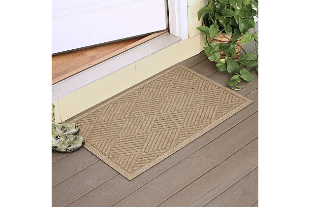 From the front door to the back door and all points in between, the Aqua Shield diamonds doormat with lattice design is sure to keep your floors clean and dry. Beyond scraping dirt from shoes and paws, it’s got an exclusive “water dam” design for unbeatable absorbency. Resistant to the most extreme weather elements, this doormat is certified slip-resistant by the National Floor Safety Institute. Talk about one heck of a welcome mat.Made of polypropylene with rubber backing | Machine made | Crush proof | Raised border keeps dirt and water in the mat, not on your floor | Absorbs one gallon of water per square yard | Mold/mildew/fade resistant | Anti-static and weather resistant | Suitable for indoor/outdoor use | Hose clean, then hang to dry or dry flat | Made in u.s.a.