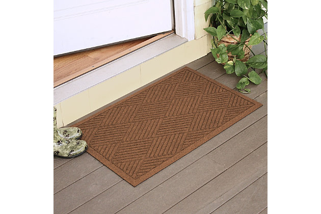 From the front door to the back door and all points in between, the Aqua Shield diamonds doormat with lattice pattern is sure to keep your floors clean and dry. Beyond scraping dirt from shoes and paws, it’s got an exclusive “water dam” design for unbeatable absorbency. Resistant to the most extreme weather elements, this doormat is certified slip-resistant by the National Floor Safety Institute. Talk about one heck of a welcome mat.Made of polypropylene with rubber backing | Machine made | Crush proof | Raised border keeps dirt and water in the mat, not on your floor | Absorbs one gallon of water per square yard | Mold/mildew/fade resistant | Anti-static and weather resistant | Suitable for indoor/outdoor use | Hose clean, then hang to dry or dry flat | Made in u.s.a.