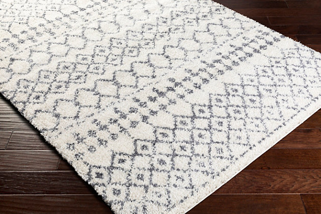 Indulge in retro revival with this sumptuous shag rug with striking geometric design. Plush pile is loaded with fun, feel-good texture. Harmonious hues make it a tasteful choice for so many spaces.Made of polypropylene and polyester | Machine woven | Shag pile | Rug pad recommended | Imported | Spot clean only