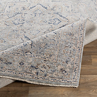 Tasteful design and harmonious hues impart a timeless look to any space. This highly versatile area rug is the perfect marriage of traditional and contemporary styles. It’s a sophisticated yet relaxed aesthetic that feels right at home.Made of polyester and viscose | Machine woven | Low pile | No backing; rug pad recommended | Spot clean | Imported