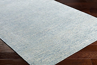 Talk about blending in yet standing out. While decidedly simple, this multitonal rug is wonderfully complex upon closer inspection. If you’re looking for colorful inspiration, you’ll love its host of hues. Exuding an easy-elegant sensibility, this versatile area rug works equally well in formal places and casually cool spaces.Made of wool and viscose | Hand-tufted | Medium pile | Rug pad recommended  | Spot clean | Imported