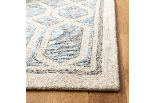 Simply timeless and beautifully on trend, this masterfully crafted Moroccan style area rug is distressed to impress. Easy elegant and casually cool, it looks right at home whether your furnishings are retro, boho or somewhere in between.Made of wool and viscose | Hand-tufted | Medium pile | Cloth (with latex) backing; rug pad recommended | Spot clean | Imported
