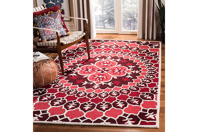 Why play it safe, when you can transform a space with big, bold and brilliant color? Saturated with deep, dramatic hues, this designer area rug stands out from the crowd for all the right reasons.100% wool | Hand-tufted | Medium pile | Rug pad recommended | Spot clean | Imported