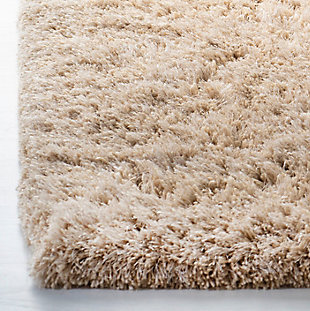 Indulge in retro revival with this sumptuous shag rug. Plush pile is loaded with fun, feel-good texture. Monochromatic hue makes it a tasteful choice for so many spaces.Made of polyester | Hand-tufted; shag pile | Rug pad recommended | Imported | Spot clean only