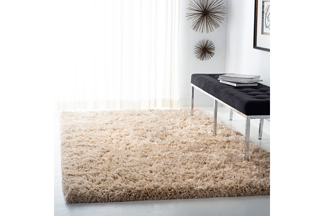 Indulge in retro revival with this sumptuous shag rug. Plush pile is loaded with fun, feel-good texture. Monochromatic hue makes it a tasteful choice for so many spaces.Made of polyester | Hand-tufted; shag pile | Rug pad recommended | Imported | Spot clean only