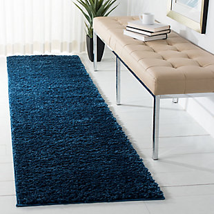 Indulge in retro revival with this sumptuous shag rug. Plush pile is loaded with fun, feel-good texture. Monochromatic hue makes it a tasteful choice for so many spaces.Made of polyester | Machine made | Shag pile | Jute and poly/cotton backing; rug pad recommended | Imported | Spot clean only