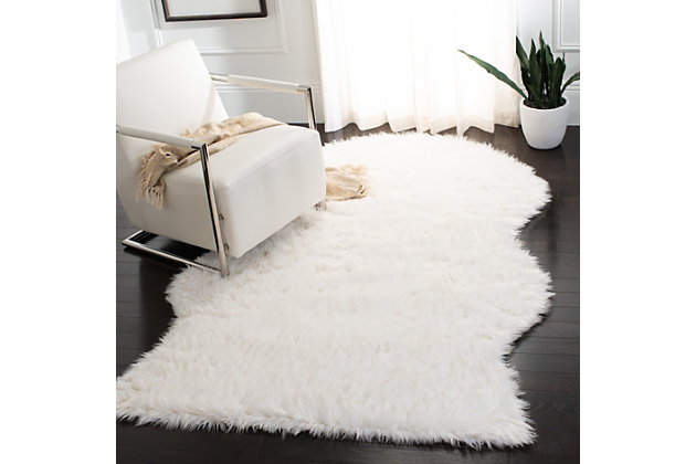 Take a walk on the wild side with this versatile faux sheepskin rug. The luxurious pile is a comfy complement to any decor. Layer on the floor, the bed or the seat of a chair for an utterly indulgent effect.Made of Japanese acrylic | Machine made | High pile | Imported | Spot clean only