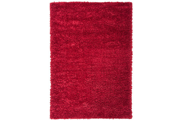 Indulge in retro revival with this sumptuous shag rug. Plush pile is loaded with fun, feel-good texture. Monochromatic hue makes it a tasteful choice for so many spaces.Made of polyester | Machine made | Shag pile | Latex backing; rug pad recommended | Imported | Spot clean only