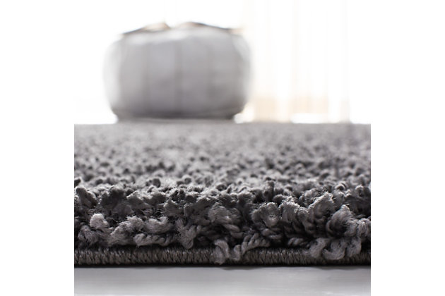 Indulge in retro revival with this sumptuous shag rug. Plush pile is loaded with fun, feel-good texture. Monochromatic hue makes it a tasteful choice for so many spaces.Made of  polypropylene | Machine woven | Shag pile | Jute and latex backing; rug pad recommended | Spot clean | Imported