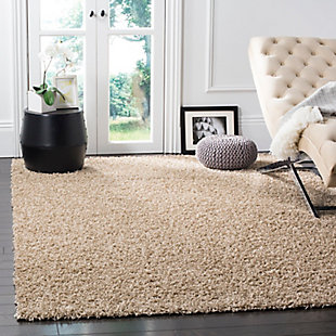 Indulge in retro revival with this sumptuous shag rug. Plush pile is loaded with fun, feel-good texture. Monochromatic hue makes it a tasteful choice for so many spaces.Made of  polypropylene | Machine woven | Shag pile | Jute backing; rug pad recommended | Spot clean | Imported