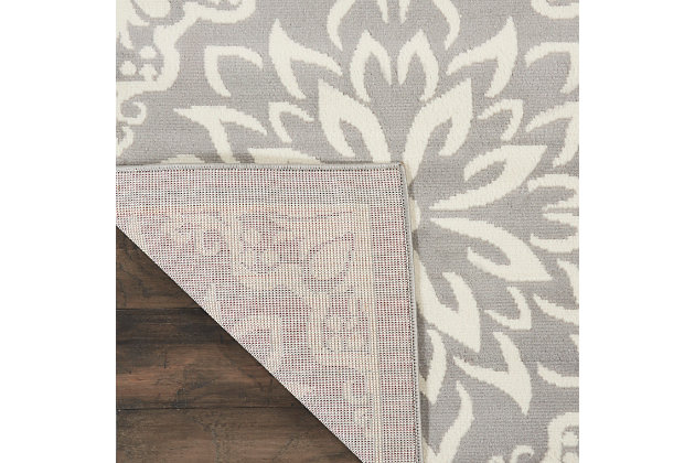 Smart and sophisticated, the jubilant collection presents contemporary rugs with fresh new looks and modern color palettes. Beautifully appealing in pastel shades of pink, blue, and grey, each rug features a durable low-pile construction from low-maintenance, easy-care fibers that will blend perfectly into any casual boho setting. Bold floral medallions burst with energy across the chic grey field of this jubilant collection rug. Sleek, low-pile construction from easy-care fibers make this a versatile, stylish accent anywhere in your home.Power loomed | Easy-care fibers | Low shedding | Low-pile