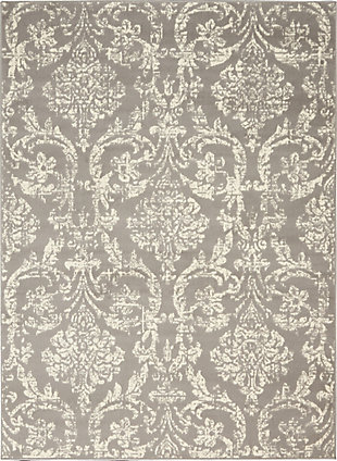 Smart and sophisticated, the jubilant collection presents contemporary rugs with fresh new looks and modern color palettes. Beautifully appealing in pastel shades of pink, blue, and grey, each rug features a durable low-pile construction from low-maintenance, easy-care fibers that will blend perfectly into any casual boho setting. Dramatically distressed color effects and ornate european damask designs bring a vintage antique vibe to this jubilant collection area rug. Striated ivory patterns on a grey field bring an authentic elegance to your favorite room, with a sleek low pile of easy-care fibers.Power loomed | Easy-care fibers | Low shedding | Low-pile