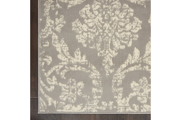 Smart and sophisticated, the jubilant collection presents contemporary rugs with fresh new looks and modern color palettes. Beautifully appealing in pastel shades of pink, blue, and grey, each rug features a durable low-pile construction from low-maintenance, easy-care fibers that will blend perfectly into any casual boho setting. Dramatically distressed color effects and ornate european damask designs bring a vintage antique vibe to this jubilant collection area rug. Striated ivory patterns on a grey field bring an authentic elegance to your favorite room, with a sleek low pile of easy-care fibers.Power loomed | Easy-care fibers | Low shedding | Low-pile